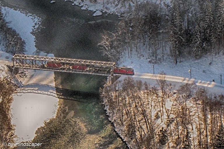 Red Train Crossing Bridge in Winter Landscape - Winter Time