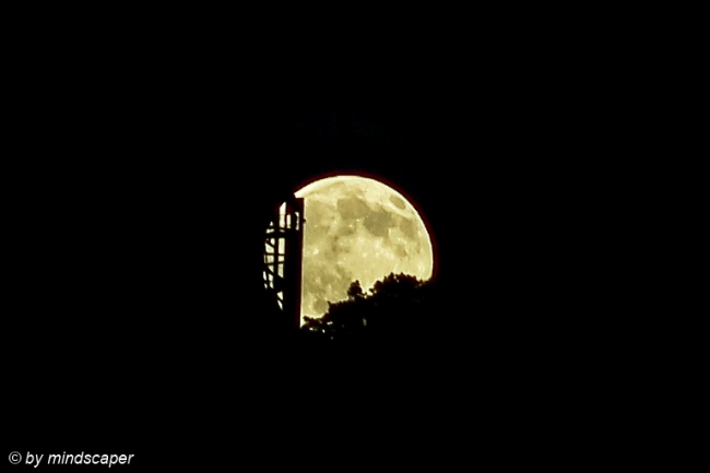 Moonrise Behind Wooden Tower