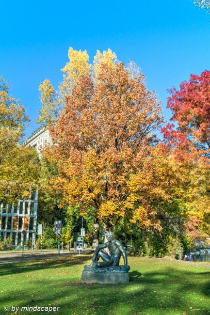 Pan Sculpture with Autumn Tree